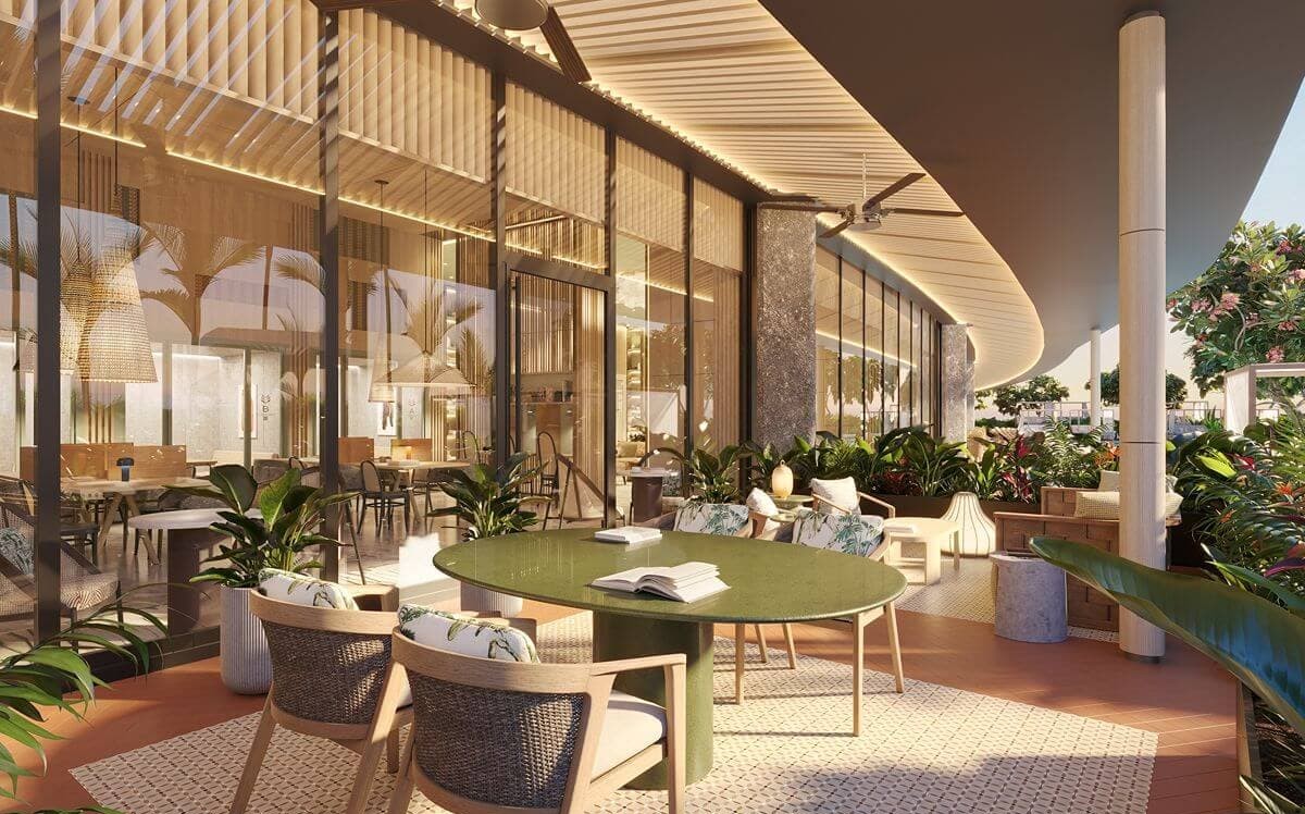 Landscaped outdoor lounge at Shang Bauhinia Residences with contemporary seating, lush greenery, and open-air spaces