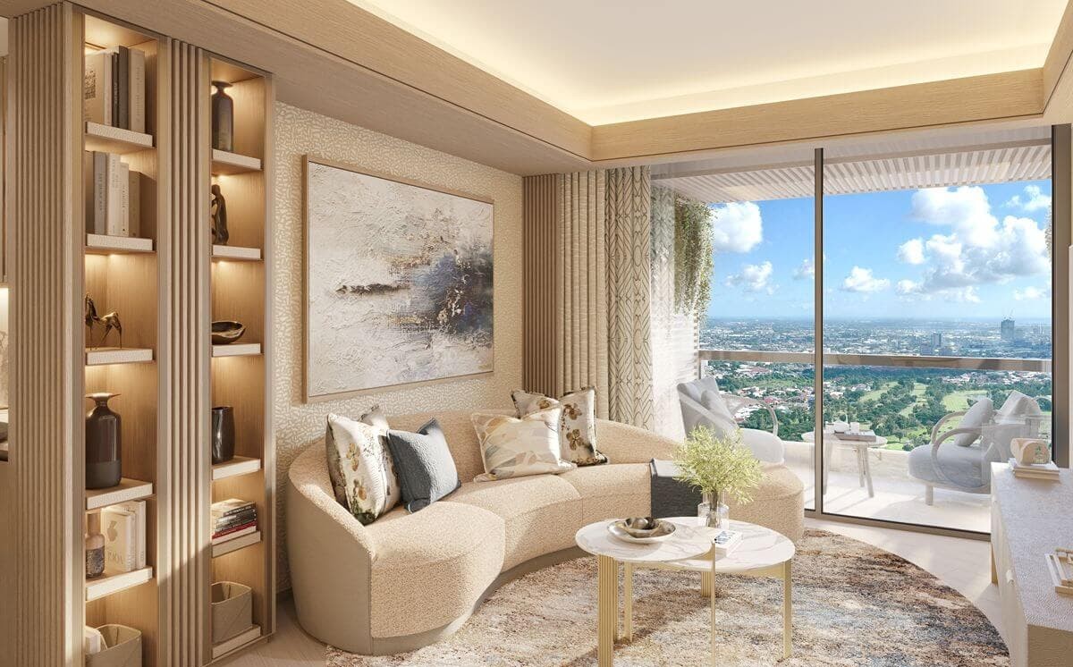 Bright Shang Bauhinia Residences living room with built-in storage, curved seating, and a balcony overlooking the Cebu cityscape