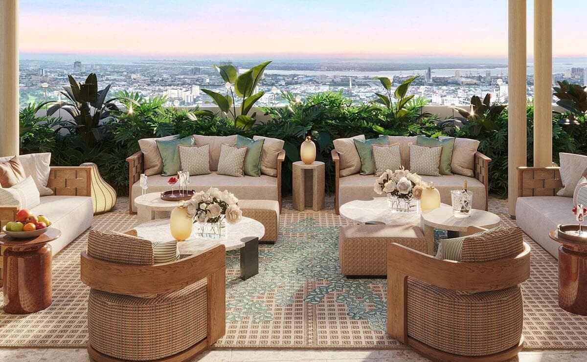 Open-air lounge at Shang Bauhinia Residences with comfortable seating, lush greenery, and panoramic views of Cebu
