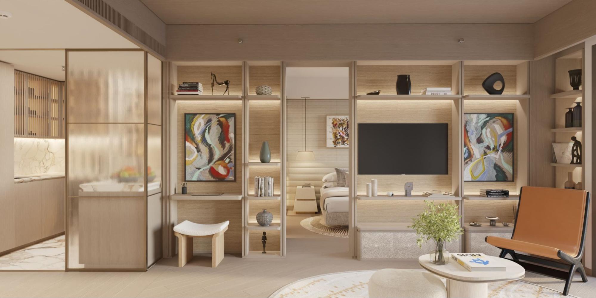 Elegant Shang Bauhinia Residences unit interior with warm wood finishes, built-in shelving, lounge seating, and bedroom view