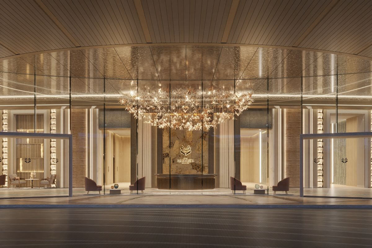 Elegant Shang Bauhinia Residences lobby entrance with warm lighting, glass façade, premium interiors, and a refined arrival area
