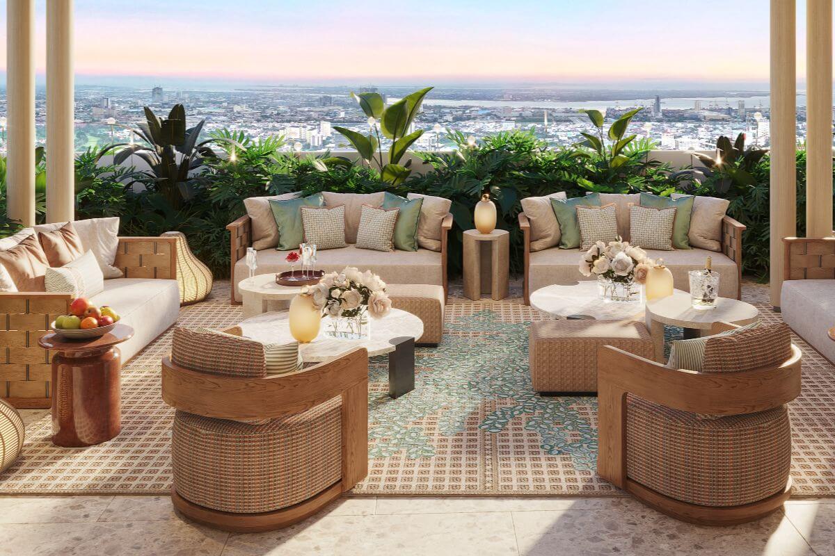 Elegant outdoor lounge at Shang Bauhinia Residences with city views, lush greenery, and refined seating for relaxed urban living