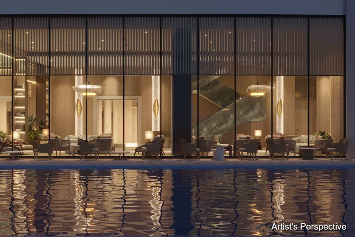 Contemporary poolside lounge at Shang Bauhinia Residences with floor-to-ceiling glass walls, refined interiors, and water reflections