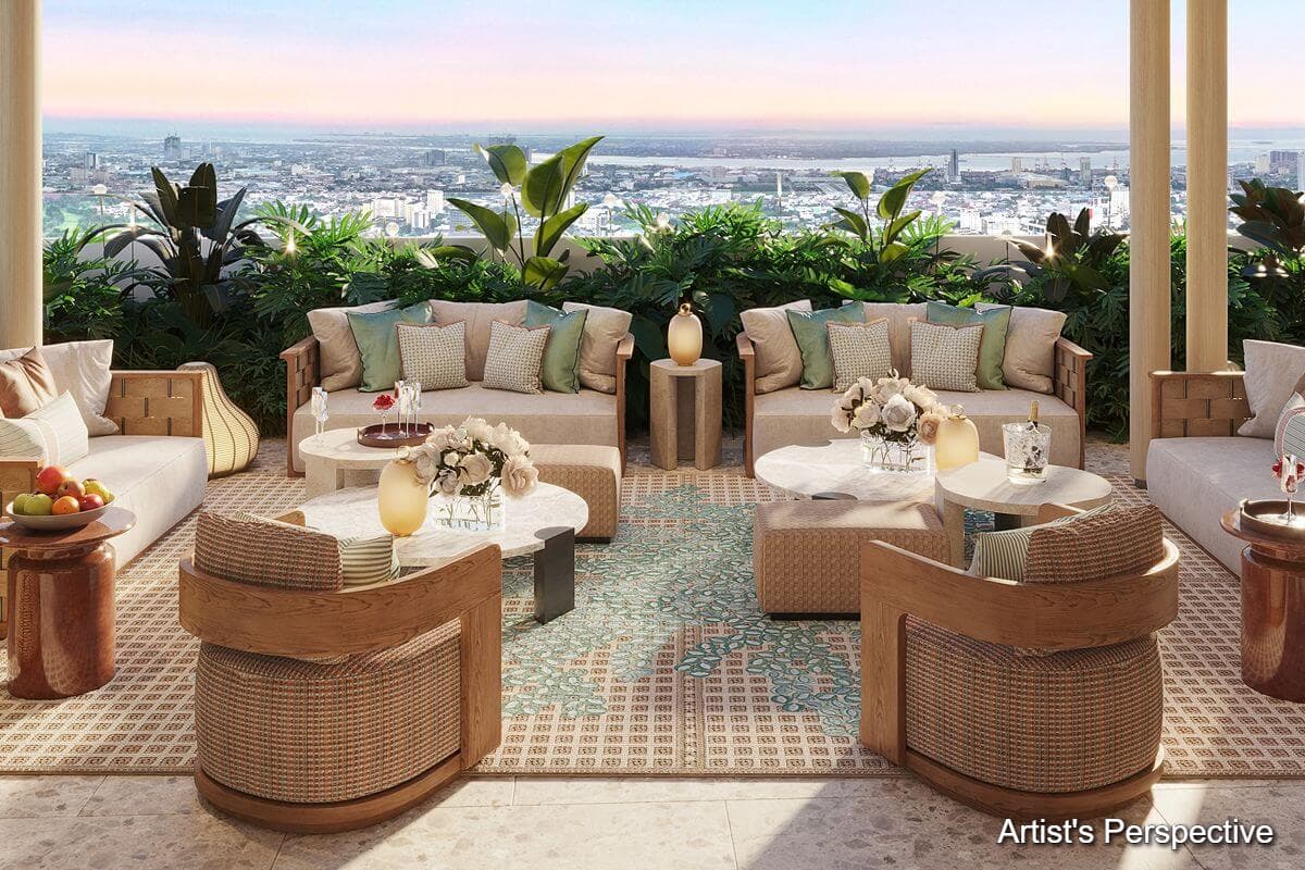 Open-air lounge at Shang Bauhinia Residences with comfortable seating, lush greenery, and panoramic views of Cebu